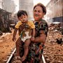 woman and child in poor neighborhood