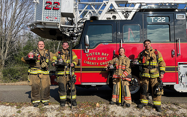 Firefighters in front of truck