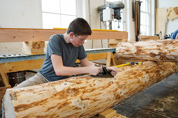 Student with hand plane