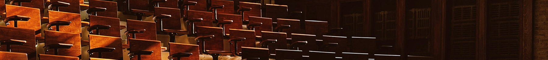 wooden seats in a lecture hall