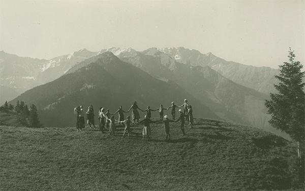 Old photo of Bruderhof members dancing in Alps