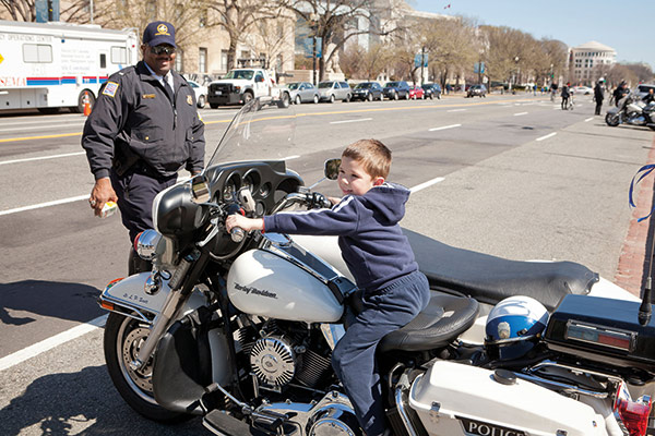 child sitting on a motorbike 