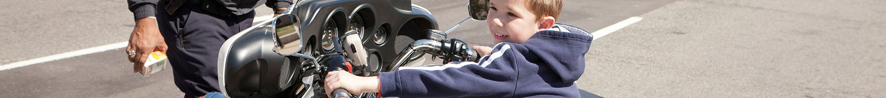 child sitting on a motorbike 