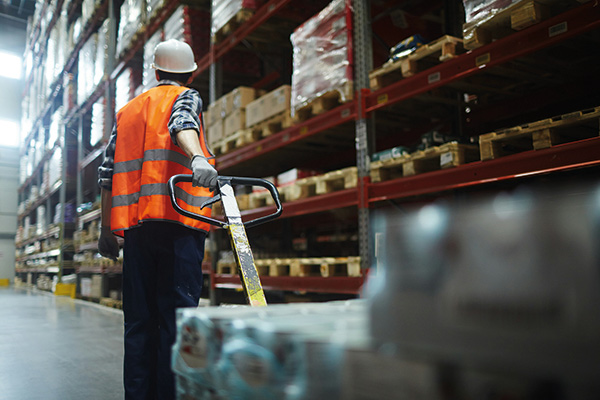 warehouse worker with a pallet jack