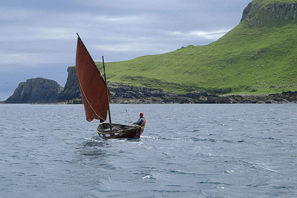 sailboat by an island